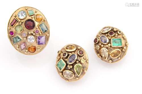 A 14k gold gem set ring and matching earclips