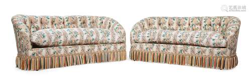 A PAIR OF KIDNEY SHAPED SOFAS IN VICTORIAN STYLE