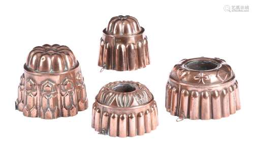 A GROUP OF FOUR COPPER JELLY MOULDS