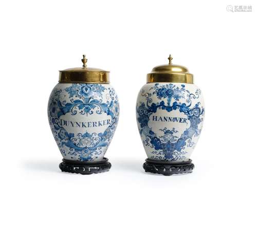 TWO SIMILAR DUTCH DELFT BLUE AND WHITE TOBACCO JARS AND ASSO...