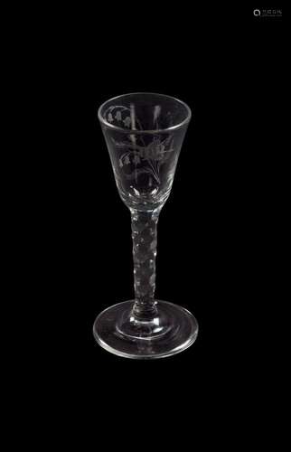 AN ENGRAVED FACET STEMMED WINE GLASS