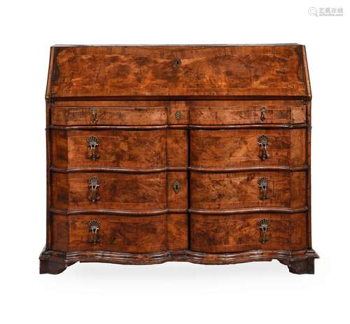 A WALNUT SERPENTINE FRONTED BUREAU, PROBABLY SOUTH GERMAN