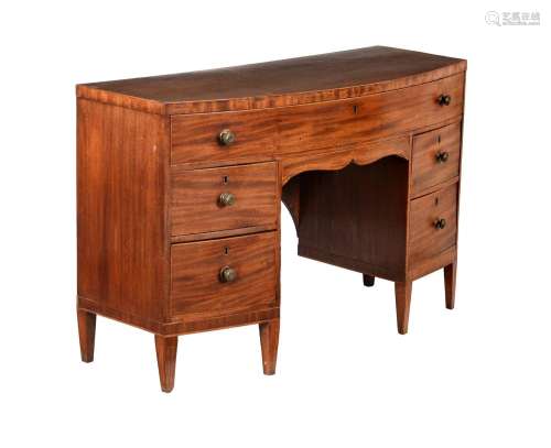 A REGENCY MAHOGANY AND LINE INLAID BOWFRONT DRESSING TABLE