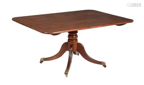 A REGENCY MAHOGANY PEDESTAL DINING TABLE