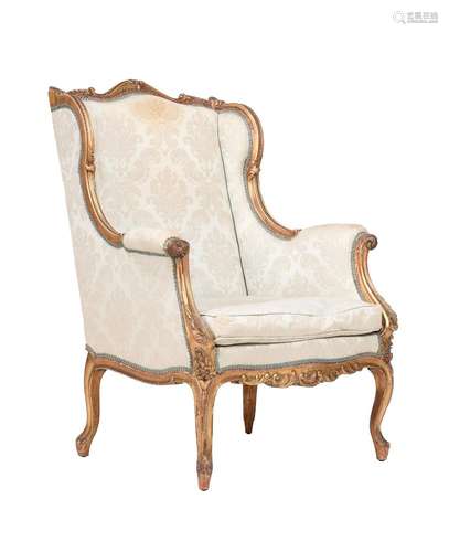 A GILTWOOD ARMCHAIR IN LOUIS XV STYLE