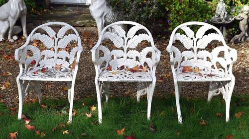 A SET OF THREE WHITE PAINTED ALUMINIUM GARDEN ARMCHAIRS