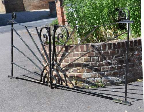 A PAIR OF BLACK PAINTED CAST IRON GARDEN GATES IN ART DECO S...