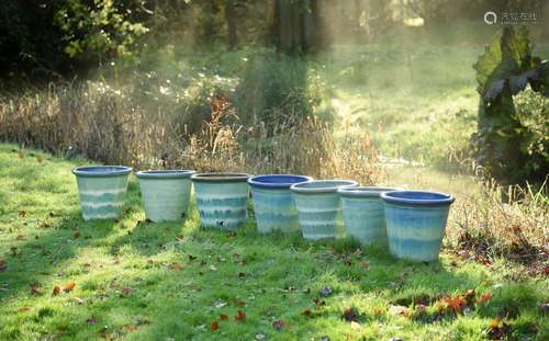 A GROUP OF SEVEN PALE TURQUOISE GLAZED PLANTERS