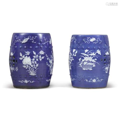 A pair of slip-decorated blue ground barrel-form garden stoo...