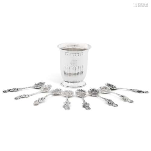 A small silver beaker and eight silver salt spoons, the beak...
