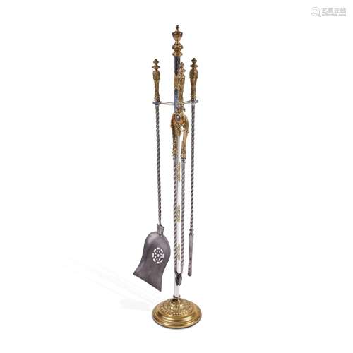 A set of a brass and polished steel fireplace tools, late 19...