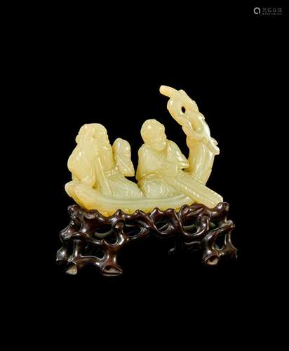 A CARVED RUSSET JADE GROUP OF AN ELDER MAN & AN ATTENDAN...