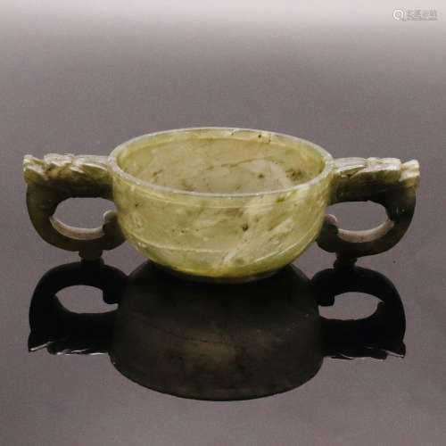 A CHINESE TWIN HANDLE SPINACH JADE CUP, QING DYNASTY (1644-1...