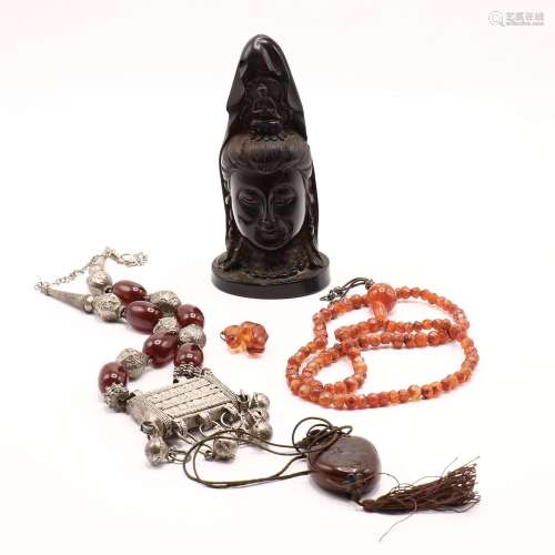 A CHINESE CHERRY AMBER HEAD OF A GUANYIN AND ASSORTMENT OF A...