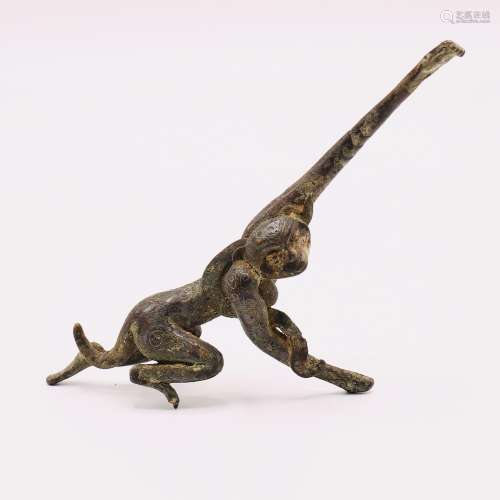 A VERY RARE CHINESE ARCHAIC BRONZE FIGURE OF A LEAPING MONKE...