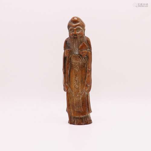 A CHINESE WOODEN FIGURE OF A MAN, QING DYNASTY (1644-1911)