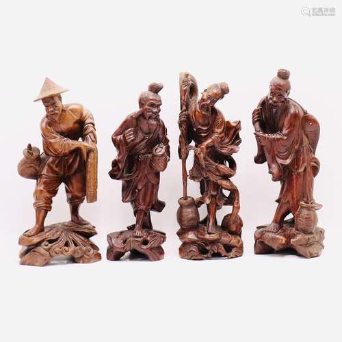 FOUR CHINESE CARVED ROSE WOOD FIGURES, QING DYNASTY (1644-19...