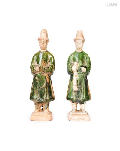 A PAIR OF CHINESE GLAZED POTTERY FIGURES OF ATTENDANTS, MING...