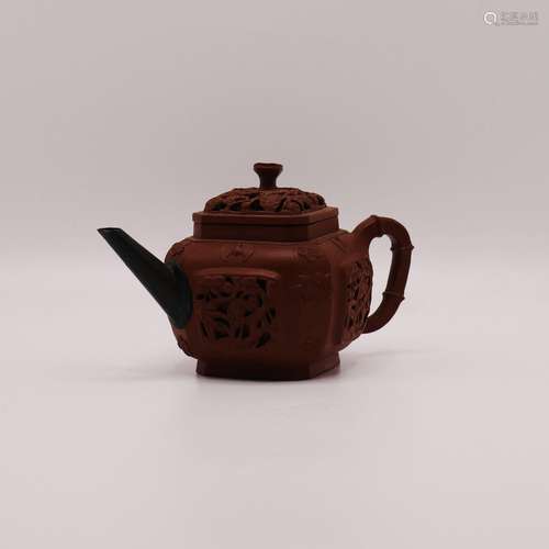 A CHINESE RETICULATED YIXING TEAPOT, QING DYNASTY (1644-1911...