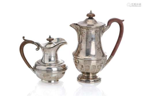 TWO ENGLISH SILVER HOT WATER POTS, 771g