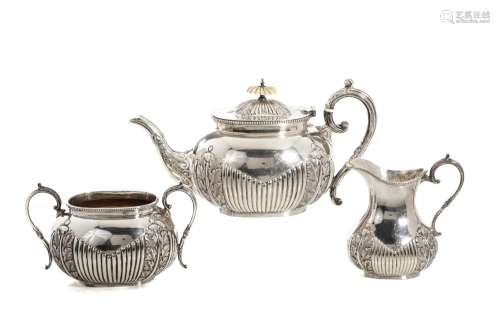 THREE-PIECE ENGLISH SILVER TEA SERVICE, 1,496g