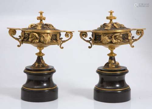 Pair of goblets in black marble, gilded and patinated bronze...