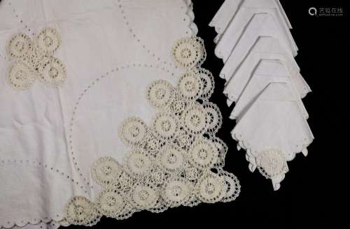 White cotton table linen with crochet embroidery and waves
