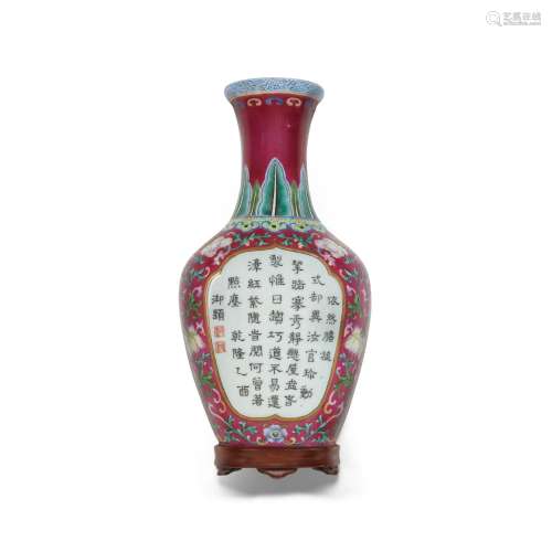 A RUBY-GROUND FAMILLE-ROSE 'IMPERIAL POEM' WALL VASE Qianlon...