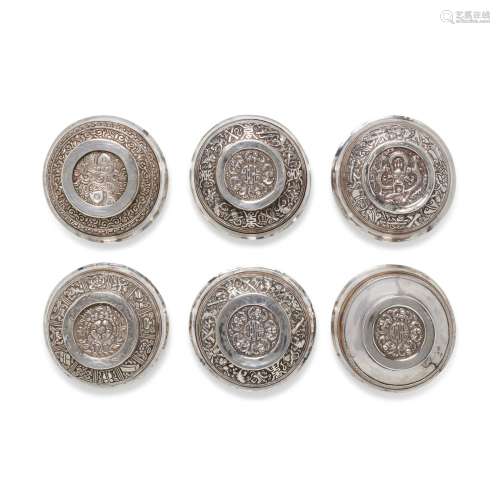 A GROUP OF SIX SILVER REPOUSSÉ-MOUNTED BURLWOOD OFFERING BOW...