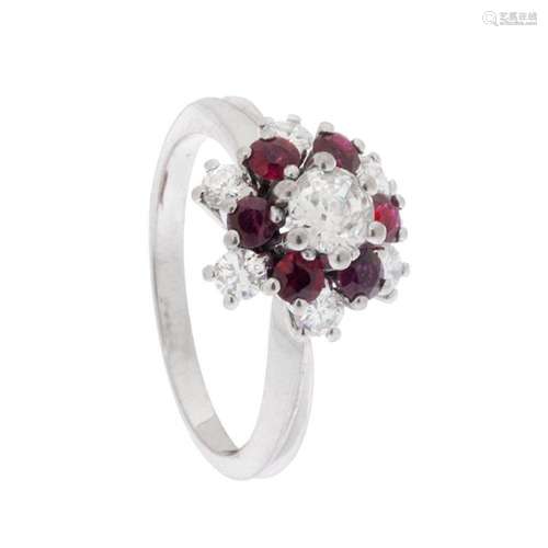 18kt white gold floral rosette ring with a central brilliant...