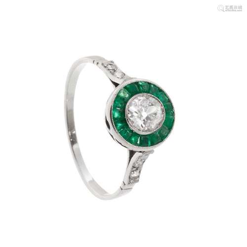 18k white gold ring. diamonds and emeralds. "Partridge`...