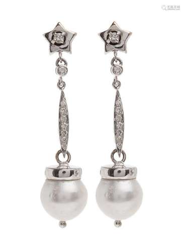 Pair of long earrings with movement in 18 kt white gold. Top...