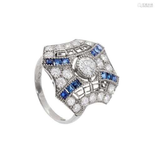 Ring in platinum, diamonds and sapphires. Model with geometr...