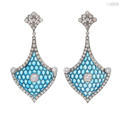 Pair of long earrings with movement in 18k white gold. Two-p...