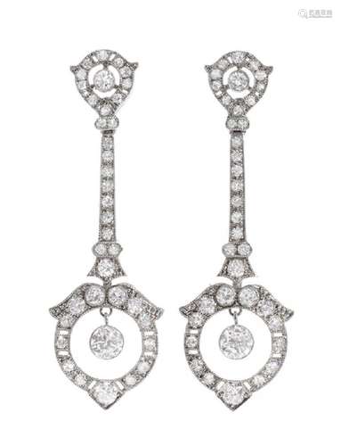 Pair of long earrings with movement in 18k white gold and di...