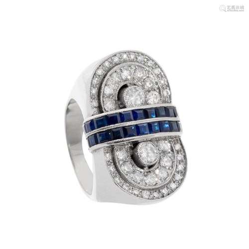 Ring in platinum, diamonds and sapphires. Model with geometr...