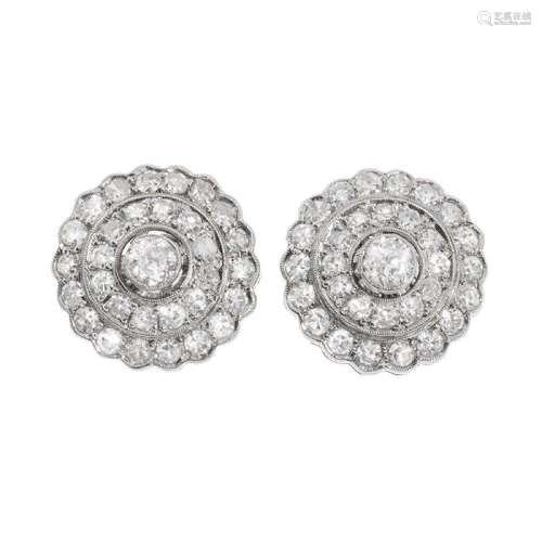 Pair of earrings in platinum, and diamonds. Rosette model in...