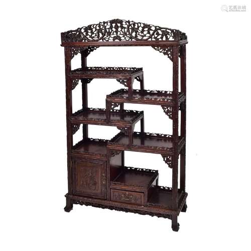 λ A CHINESE CARVED ROSEWOOD OPEN-SHELVED CABINET, QING DYNAS...