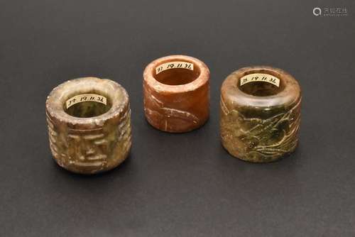 A GROUP OF THREE CHINESE CARVED JADE ARCHERS THUMB RINGS, QI...