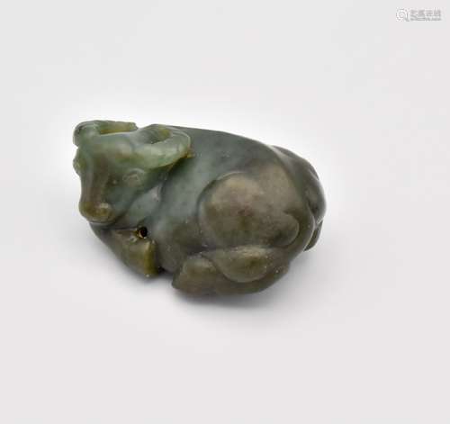 A CHINESE GREEN JADE CARVING OF A RECUMBENT WATER BUFFALO, Q...