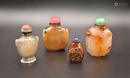 A GROUP OF FOUR CHINESE HARDSTONE SNUFF BOTTLES, QING DYNAST...