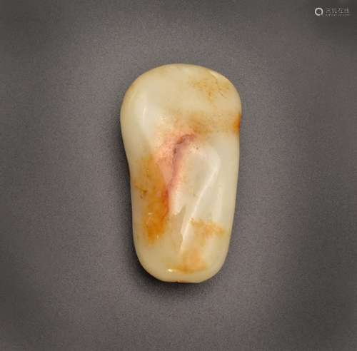 A CHINESE WHITE AND RUSSET JADE ‘PEBBLE’ SNUFF BOTTLE, QING ...