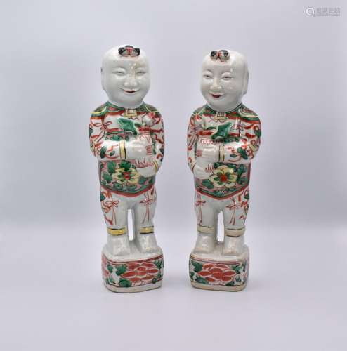 A PAIR OF CHINESE ‘LAUGHING BOYS’ PORCELAIN FIGURES, QING DY...