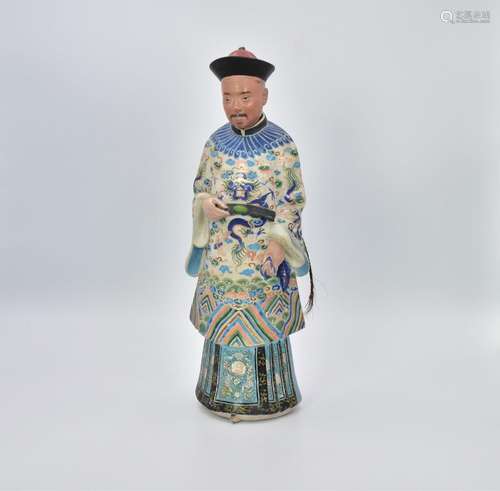 A CHINESE EXPORT NODDING-HEAD CLAY FIGURE OF A MANDARIN OFFI...