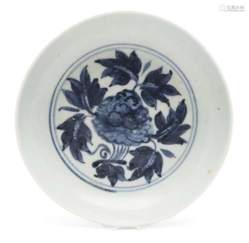 A blue and white dish with peony design