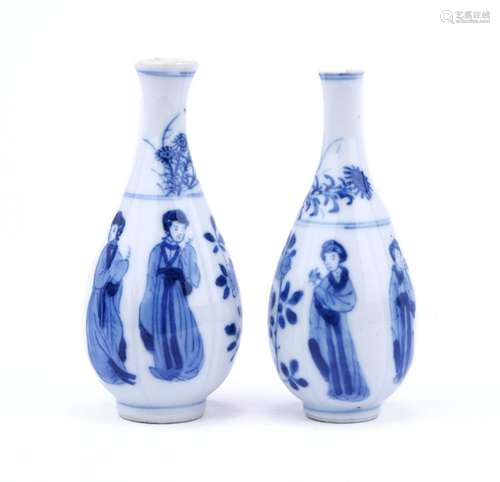 Two small pear shaped blue and white vases