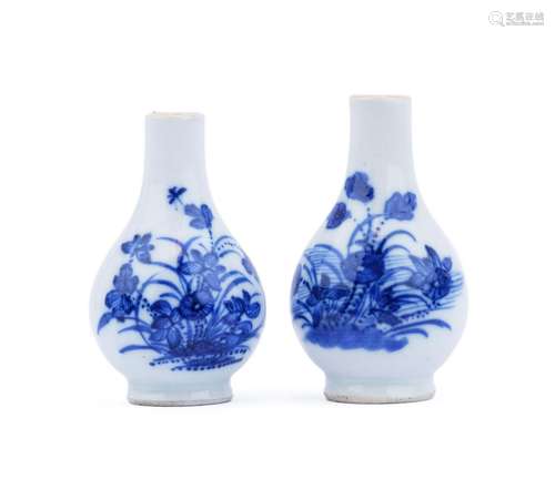 A pair of small blue and white vases