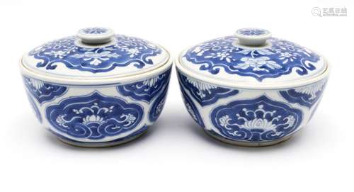 A pair of blue and white low covered pots