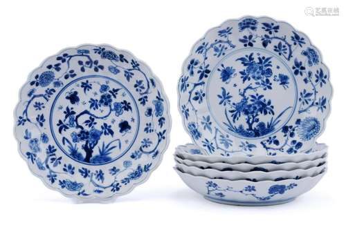 Six small lobed blue and white dishes