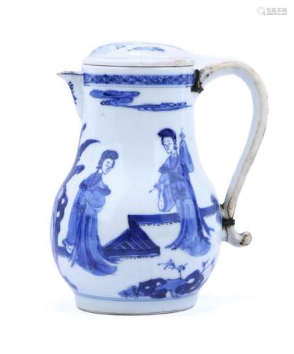 A blue and white covered pitcher